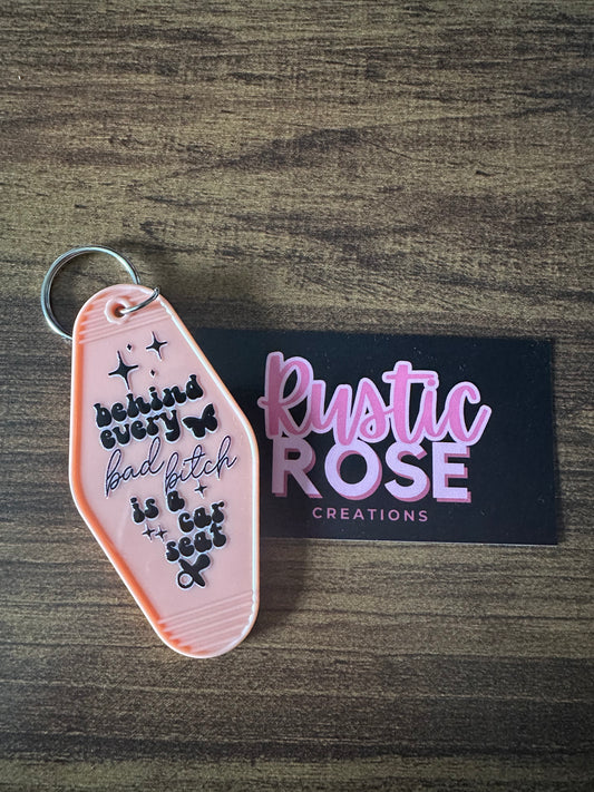 Behind ever bad b**ch is a carseat -Motel Keychain